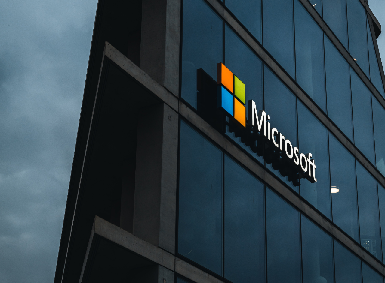image of microsoft building at night. microsoft's copilot brings ai to your word, excel and powerpoint documents