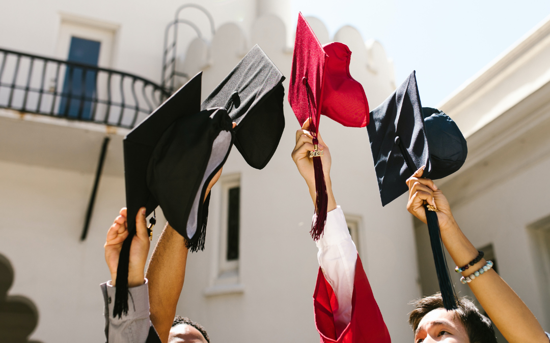 ai in higher education students holding graduation caps