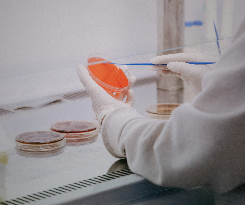 researcher in the healthcare industry swapping a sample