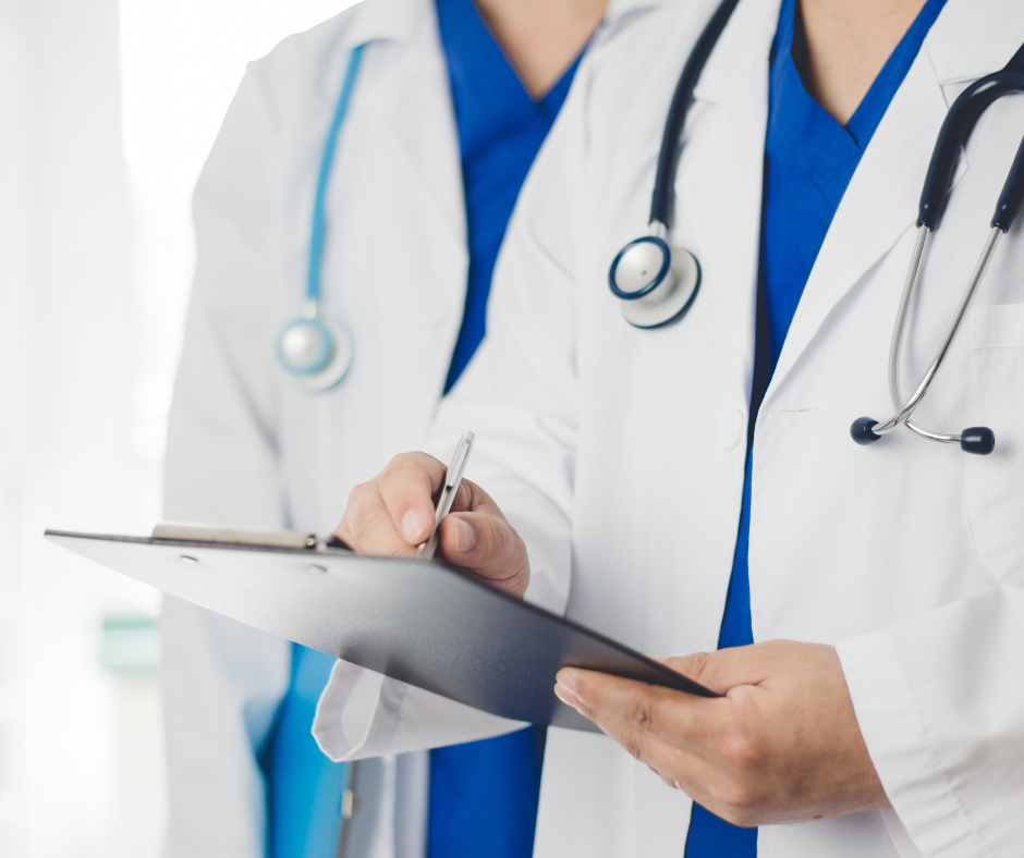 two doctors holding pen healthscribe